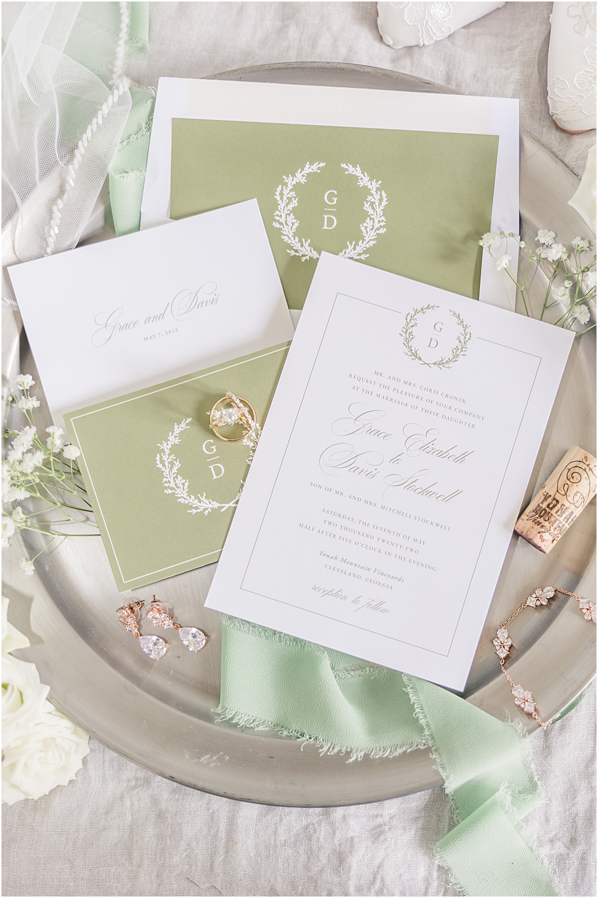 Wedding details including invitations and earrings