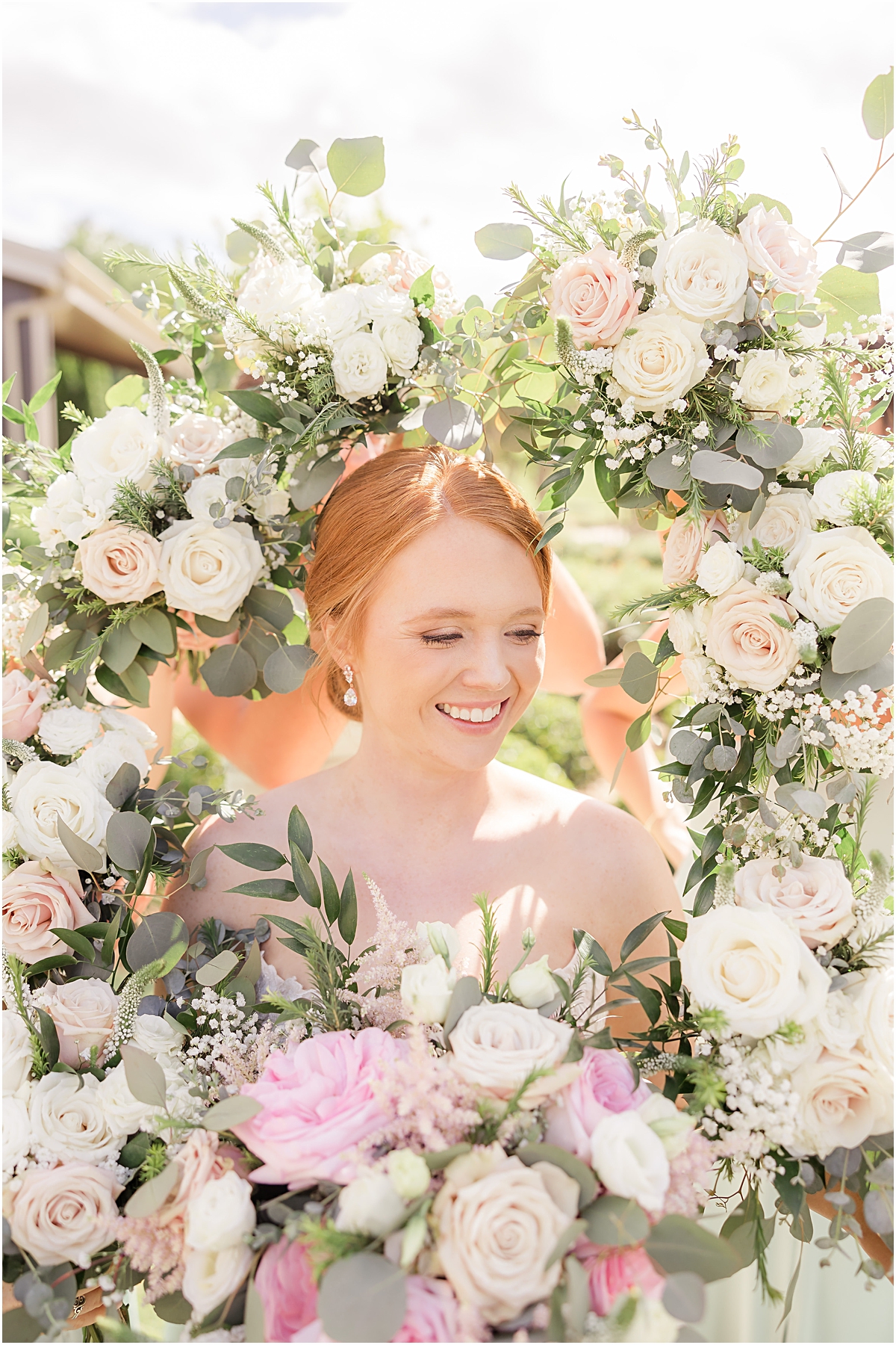 Bride surrounded by flowers 