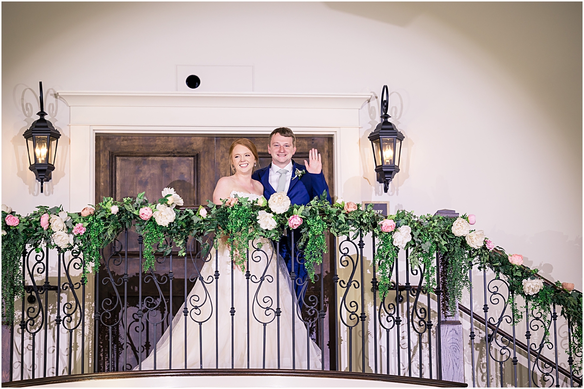 Grace and Davis standing atop a staircase at Cleveland GA Wedding Venues