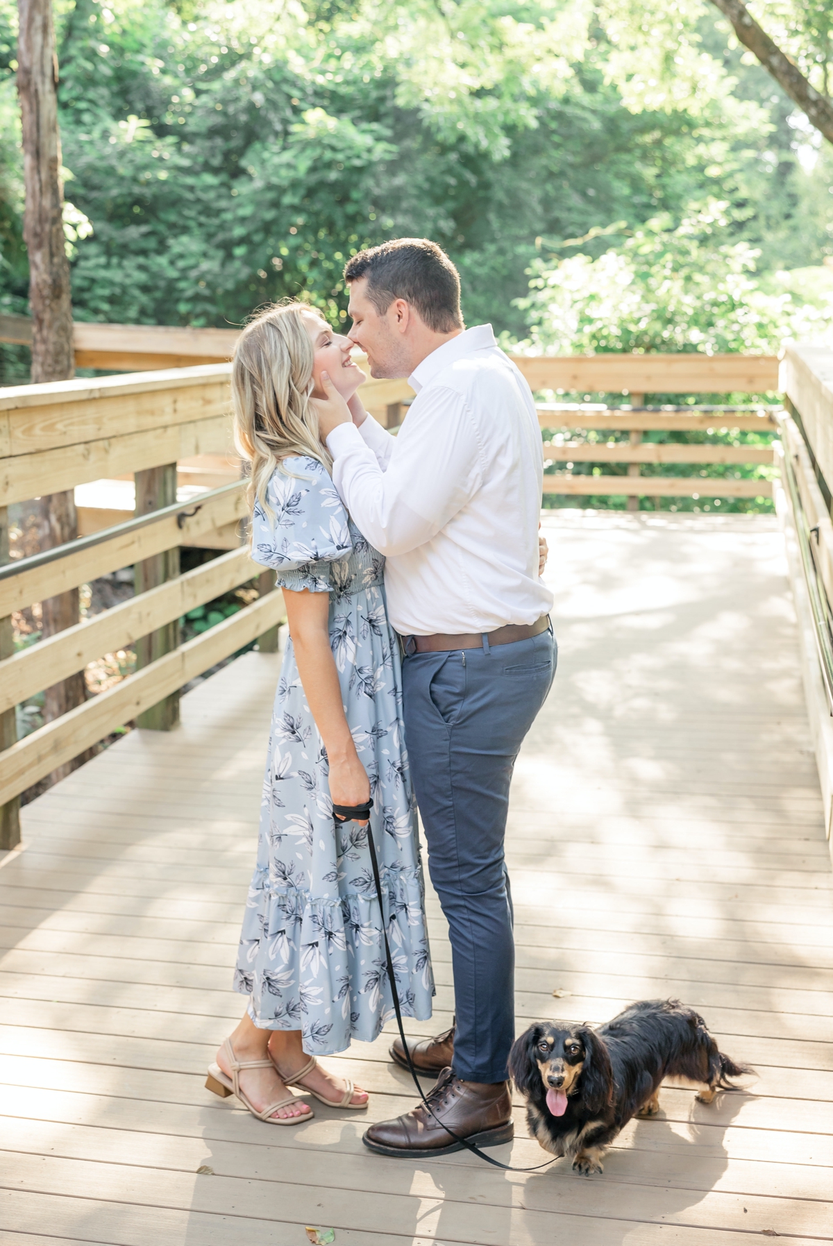 Taylor holding Julia's face while he kisses her during their engagement session.