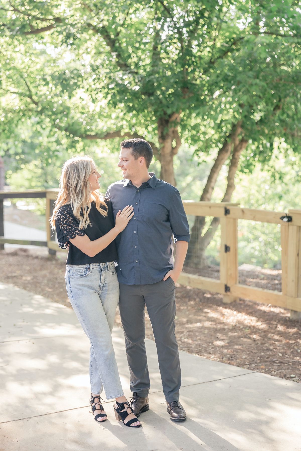 Julia with her hand on Austin's chest during their engagement session.