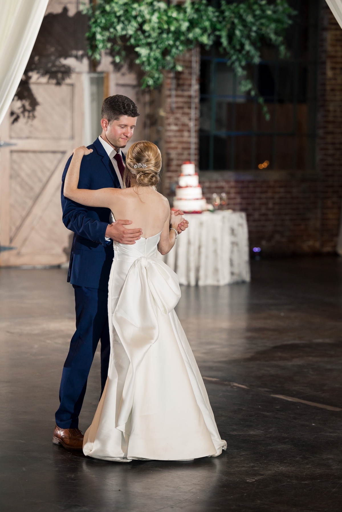 Rebecca and Josh during their first dance on their wedding day at Foundry Puritan Mill.