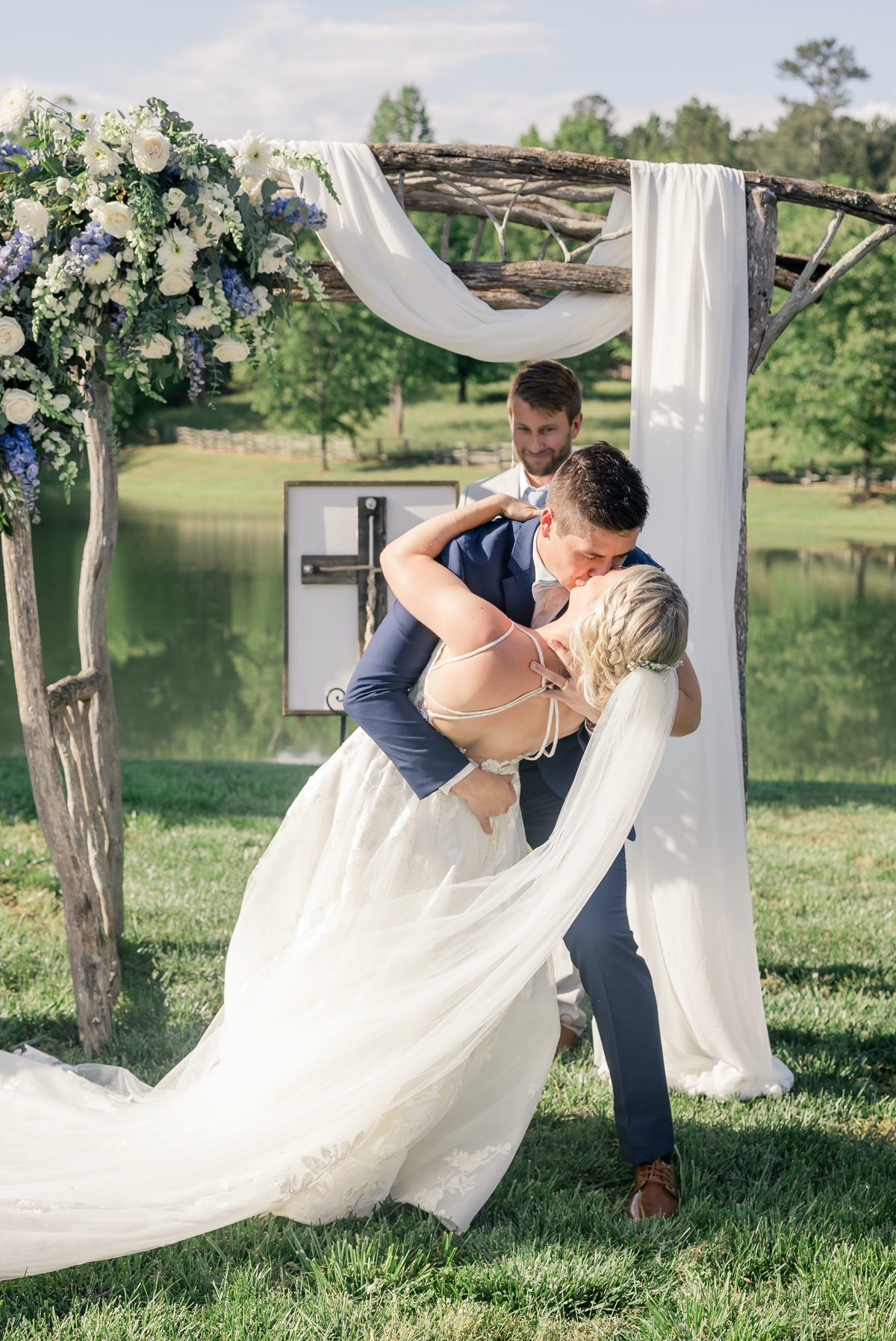 Chris dipping and kissing Grace during their first kiss as husband and wife at Walters Barn.